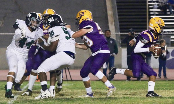 Lemoore quarterback, Ty Chambers, breaks free in the second quarter of Friday's home game against visiting El Diamante. The Tigers beat the Miners 34-30 to remain unbeaten in the WYL.